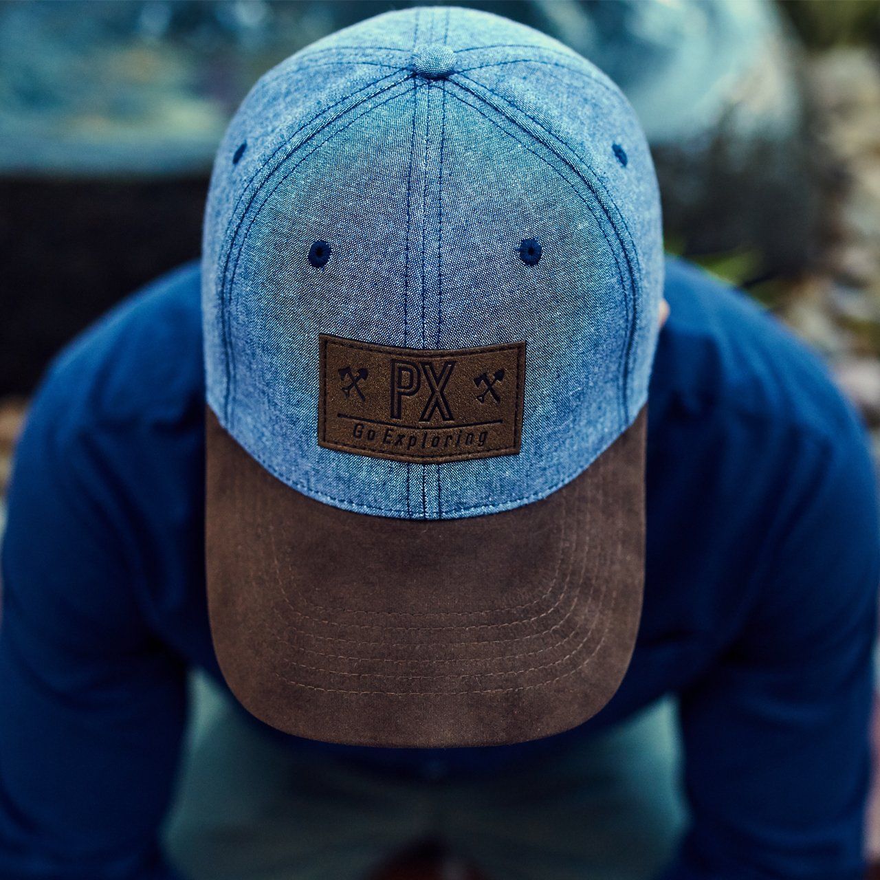 Person wearing a PX cap.